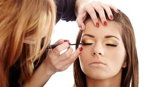 Closeup of a makeup artist applying makeup